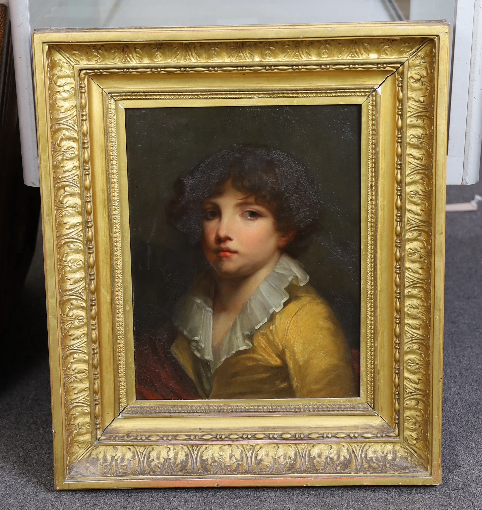 19th century Continental School, Portrait of a youth wearing a yellow jacket, oil on wooden panel, 39 x 30cm